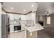 Bright kitchen boasts white cabinetry, stainless steel appliances, and granite counters at 750 E Northern E Ave # 2145, Phoenix, AZ 85020
