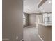 Open-concept design with a view from the living area into the kitchen and breakfast bar at 750 E Northern E Ave # 2145, Phoenix, AZ 85020