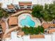 Aerial view of a refreshing community pool and seating area with mature landscaping at 750 E Northern E Ave # 2145, Phoenix, AZ 85020