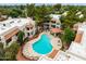 Aerial view of a community pool surrounded by lounge chairs and lush landscaping at 750 E Northern E Ave # 2145, Phoenix, AZ 85020
