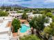 Overhead view of a kidney shaped community pool with ample seating and mountain views at 750 E Northern E Ave # 2145, Phoenix, AZ 85020