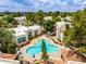 An aerial view of a community pool with a uniquely designed shape with tables and chairs at 750 E Northern E Ave # 2145, Phoenix, AZ 85020