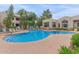 Inviting community swimming pool features clear blue water, lounge chairs, and well-kept landscaping near the buildings at 750 E Northern E Ave # 2145, Phoenix, AZ 85020