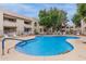 Beautiful community pool with blue accents, surrounded by well-maintained condo buildings on a pleasant day at 750 E Northern E Ave # 2145, Phoenix, AZ 85020