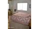 Comfortable bedroom with carpet, neutral walls, and a mirrored closet at 8310 E Deep Canyon Ct, Mesa, AZ 85208