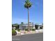 Charming single story home with desert landscaping, mature tree and sidewalk at 8310 E Deep Canyon Ct, Mesa, AZ 85208