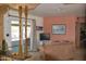 Cozy living area featuring wood beam accents, tile floors and a patio access at 8310 E Deep Canyon Ct, Mesa, AZ 85208