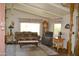 Comfortable living room featuring western decor, wood floors, and natural lighting at 8310 E Deep Canyon Ct, Mesa, AZ 85208