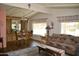 Cozy living area with a dining room, wood floors, and a Southwest-style sofa at 8310 E Deep Canyon Ct, Mesa, AZ 85208