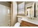 Bright bathroom featuring a glass-enclosed shower, toilet, sink and vanity with light brown cabinetry at 9302 E Horseshoe Bend Dr, Scottsdale, AZ 85255