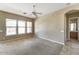 Spacious bedroom with neutral carpet and three large windows at 9302 E Horseshoe Bend Dr, Scottsdale, AZ 85255