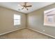 Bedroom featuring a neutral wall, carpet, two windows and a ceiling fan at 9302 E Horseshoe Bend Dr, Scottsdale, AZ 85255