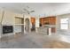 Open living space featuring a fireplace and kitchen with wood cabinets at 9302 E Horseshoe Bend Dr, Scottsdale, AZ 85255