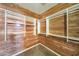 Walk-in closet featuring extensive white shelving and wooden cedar walls with neutral carpeting at 9302 E Horseshoe Bend Dr, Scottsdale, AZ 85255