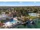 Aerial view of a community pool and clubhouse surrounded by lush landscaping and a serene lake at 1001 N Peppertree Dr, Gilbert, AZ 85234
