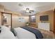 Bedroom with a ceiling fan and a window seat, and a mounted television, creating a comfortable space at 1001 N Peppertree Dr, Gilbert, AZ 85234