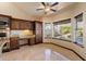 Bright dining area with built-in cabinets and sunlit windows offering outdoor views at 1001 N Peppertree Dr, Gilbert, AZ 85234