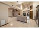 Open kitchen featuring dark cabinets, granite counters, and an expansive breakfast bar area at 1001 N Peppertree Dr, Gilbert, AZ 85234
