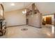 Expansive living room showcasing tile flooring, high ceilings, and a neutral color palette at 1001 N Peppertree Dr, Gilbert, AZ 85234