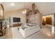 Spacious living room featuring high ceilings, a fireplace, and elegant neutral decor at 1001 N Peppertree Dr, Gilbert, AZ 85234