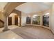 Bright living room features tile floors and large windows with plenty of natural light at 1001 N Peppertree Dr, Gilbert, AZ 85234