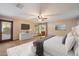 Main bedroom featuring a plush bed, modern ceiling fan and television set at 1001 N Peppertree Dr, Gilbert, AZ 85234