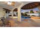Covered patio with tiled flooring overlooking a private pool and spa, perfect for outdoor living and entertaining at 1001 N Peppertree Dr, Gilbert, AZ 85234