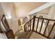 View of staircase with tile steps and wood railing at 1001 N Peppertree Dr, Gilbert, AZ 85234