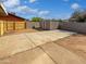 Spacious backyard with block walls, a shed, and large concrete pad at 1019 N 62Nd Ave, Phoenix, AZ 85043