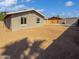 View of backyard with block walls, partial fence, shed, and space for activities at 1019 N 62Nd Ave, Phoenix, AZ 85043