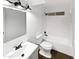 Modern bathroom with a white vanity, updated fixtures, and a clean, functional design at 1019 N 62Nd Ave, Phoenix, AZ 85043