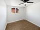 Bright bedroom features a ceiling fan, window and attractive flooring at 1019 N 62Nd Ave, Phoenix, AZ 85043