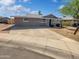 Inviting home with a covered entry, well-maintained exterior, and a spacious driveway at 1019 N 62Nd Ave, Phoenix, AZ 85043