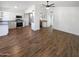 Bright and airy living space featuring wood-look floors and an open layout to the kitchen at 1019 N 62Nd Ave, Phoenix, AZ 85043