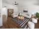 Bright and airy living room featuring stylish furniture, a ceiling fan, and wood-look flooring at 1019 N 62Nd Ave, Phoenix, AZ 85043