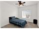 Well-lit bedroom featuring neutral walls, carpet, and a large window at 10539 W Tamara Dr, Casa Grande, AZ 85193