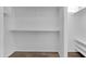 Bright closet with built in shelving and laminate flooring for organized storage space at 10539 W Tamara Dr, Casa Grande, AZ 85193