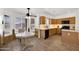 Charming kitchen with a breakfast nook, wood cabinets, and natural light at 10539 W Tamara Dr, Casa Grande, AZ 85193