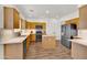 Modern kitchen featuring updated appliances, ample cabinet space, and a functional island at 10539 W Tamara Dr, Casa Grande, AZ 85193