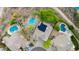 Aerial shot showcasing this property's solar panels and the backyard oasis with multiple pools at 10875 E Mirasol Cir, Scottsdale, AZ 85255