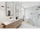 Bright bathroom with a soaking tub, walk-in shower, dual sinks and a closet at 10875 E Mirasol Cir, Scottsdale, AZ 85255