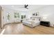 Bright bedroom with a ceiling fan, hardwood floors and an outdoor view at 10875 E Mirasol Cir, Scottsdale, AZ 85255