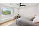 Cozy bedroom with a window view and simple desk setup at 10875 E Mirasol Cir, Scottsdale, AZ 85255
