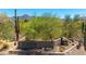 McDowell Mountain Ranch entrance sign with desert landscaping and mountain views on a sunny day at 10875 E Mirasol Cir, Scottsdale, AZ 85255