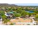 Aerial shot showcases a community park with pool, tennis courts, and a basketball court at 10875 E Mirasol Cir, Scottsdale, AZ 85255