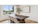 Dining area features an outdoor view, modern lighting and decor at 10875 E Mirasol Cir, Scottsdale, AZ 85255