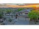 Beautiful two-story home, showcasing a three-car garage, desert landscaping, and a distant mountain view at 10875 E Mirasol Cir, Scottsdale, AZ 85255