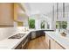 Bright modern kitchen features quartz countertops, stainless steel appliances, and hardwood floors at 10875 E Mirasol Cir, Scottsdale, AZ 85255