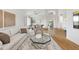 Bright living room showcases an open floor plan, wood floors, and modern furnishings at 10875 E Mirasol Cir, Scottsdale, AZ 85255