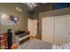 This bedroom features a ceiling fan, hardwood floors, and closet storage at 1109 E San Pedro Ave, Gilbert, AZ 85234